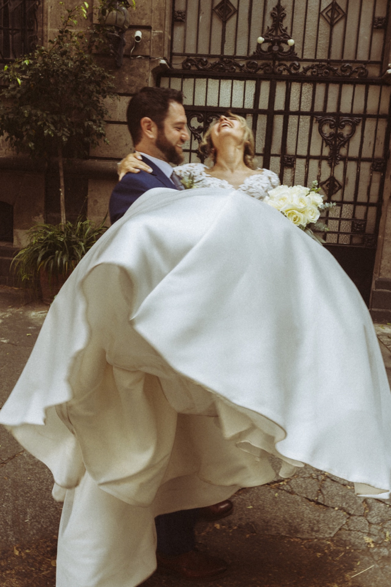 Groom carrying bride